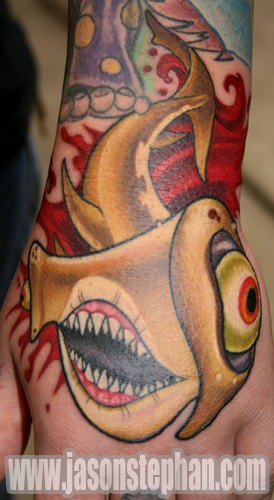 I want to get a hammerhead shark in a rose under one armpit